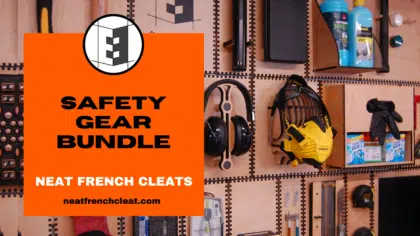 Promotional image for the Neat French Cleat "Safety Gear Bundle." The bold orange box in the foreground displays the text "Safety Gear Bundle" and "Neat French Cleats" along with the website URL neatfrenchcleat.com. The background shows a well-organized French cleat wall system with holders for essential safety gear, including ear defenders, gloves, and a mask. This bundle provides organized, accessible storage for safety equipment, ideal for a tidy and efficient workshop setup.