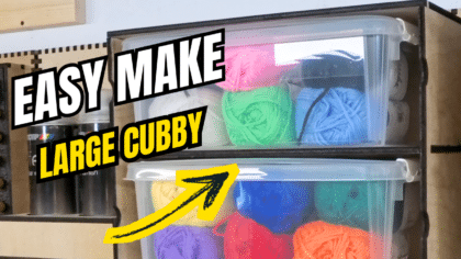 Easy Make Large Cubby thumbnail showing a plywood French cleat cubby holding two clear boxes of colourful yarn, with bold text “EASY MAKE LARGE CUBBY” and a yellow arrow pointing to the storage.