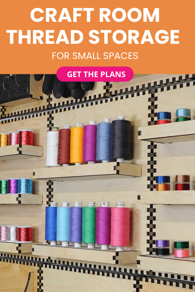 Laser-cut French cleat thread storage shelves on a plywood wall, holding rows of colorful sewing thread spools and bobbins in a compact craft room setup.