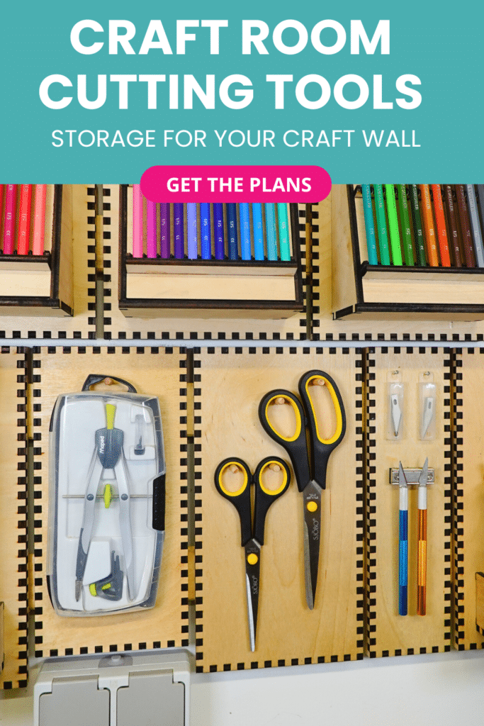 Laser-cut French cleat cutting tools holders on a plywood wall, shown straight-on with scissors, craft knives, spare blades, and a compass set neatly stored on individual panels.